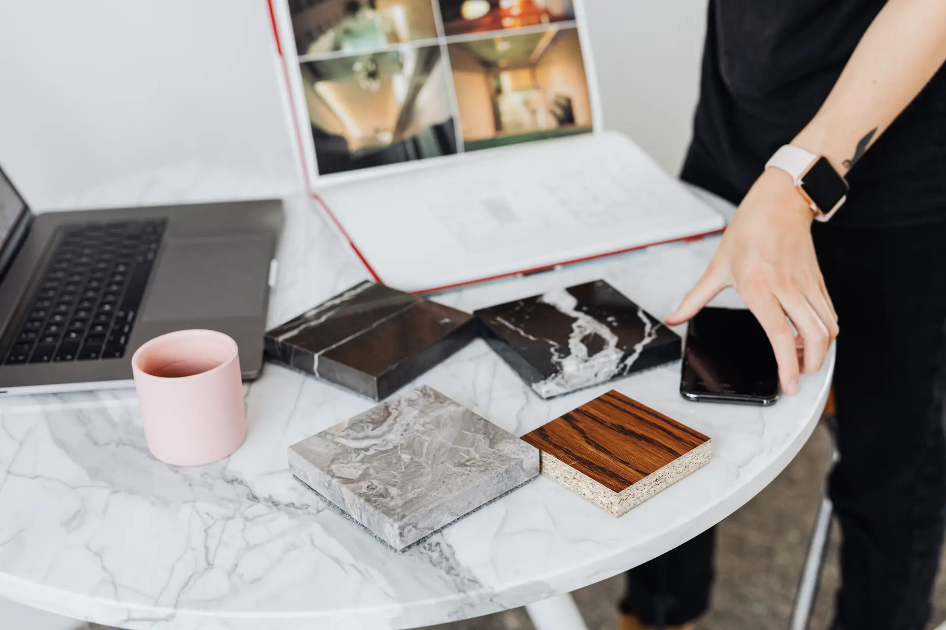 Warm contemporary Australian interior design workspace with material samples and bright natural light