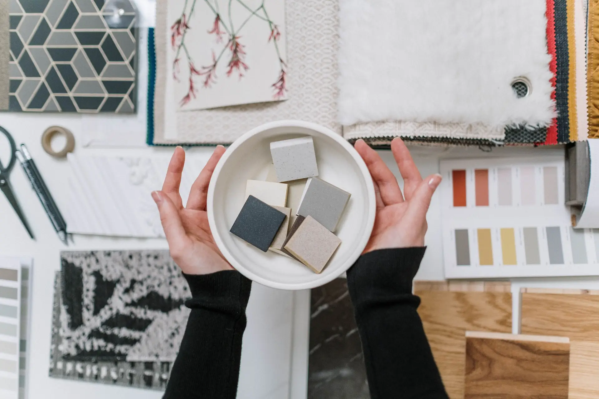 Interior designer selecting materials and color swatches